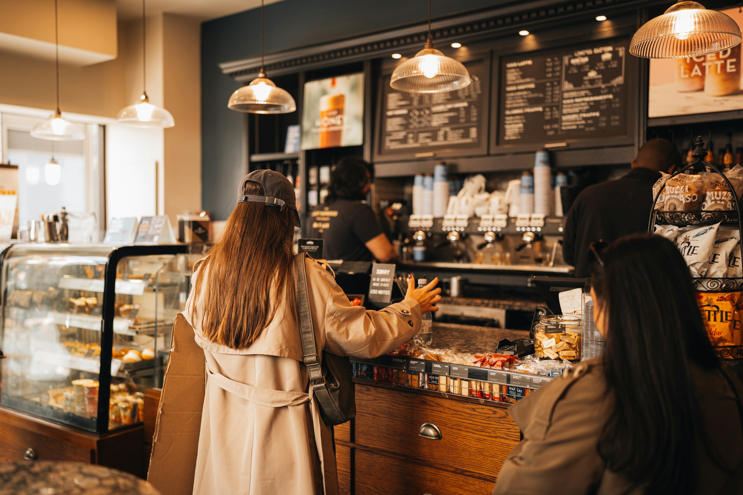 Guests ordering at a cafe counter