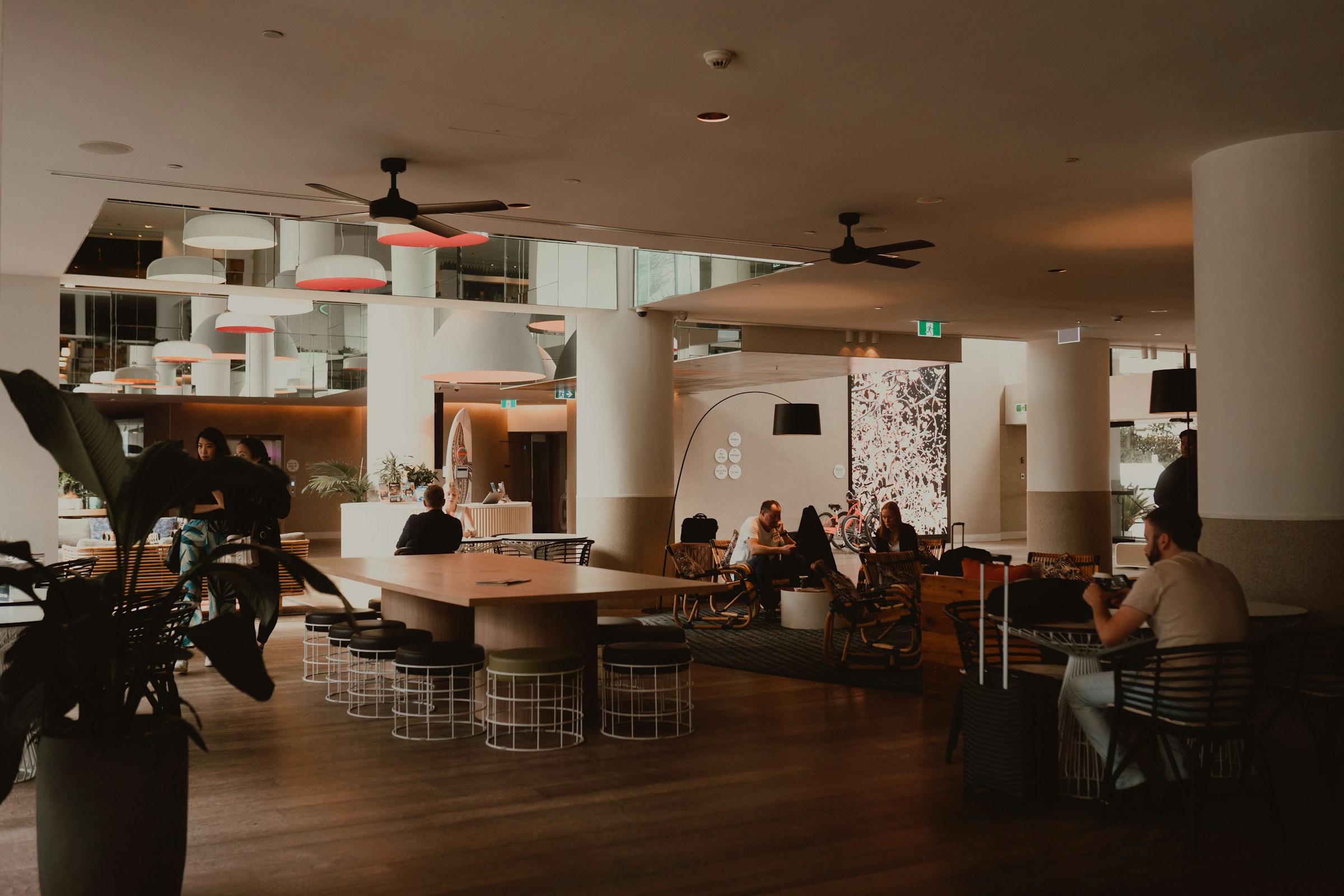 People relaxing in a modern hotel lobby lounge